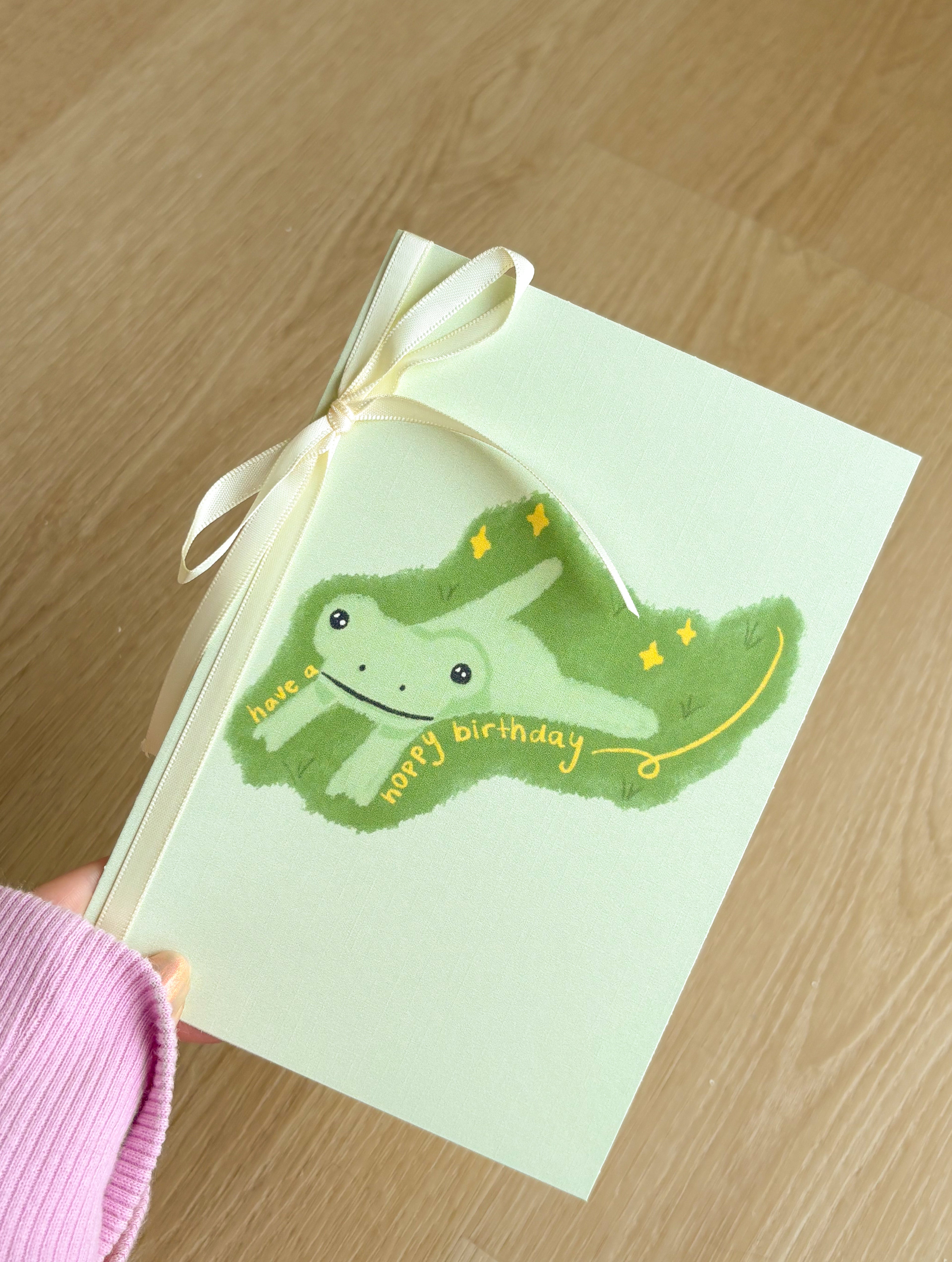 "Have a Hoppy Birthday" Ivory Linen Textured Card With Ribbon